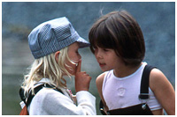 Kids Being Kids - Sharing a Secret on the Beach